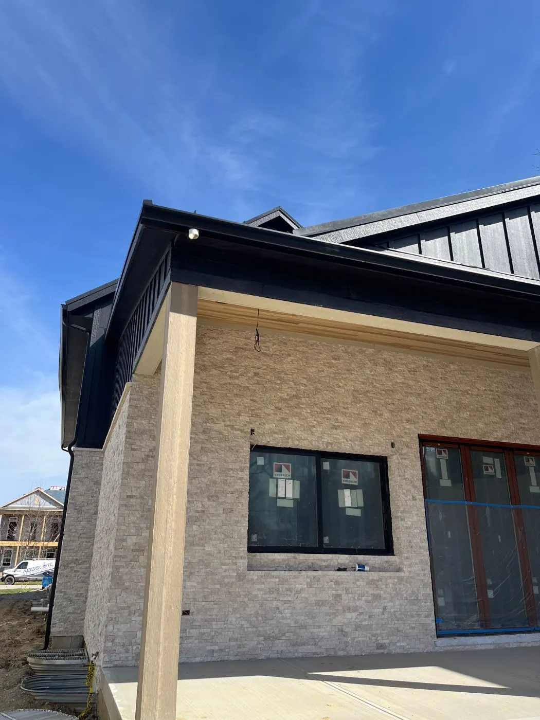Tarping and dry-in on a Raintree Village commercial roof